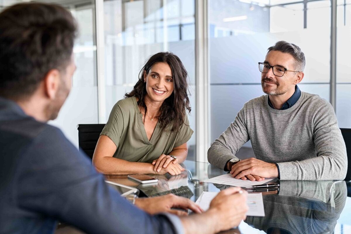 business owners speaking to insurance professional