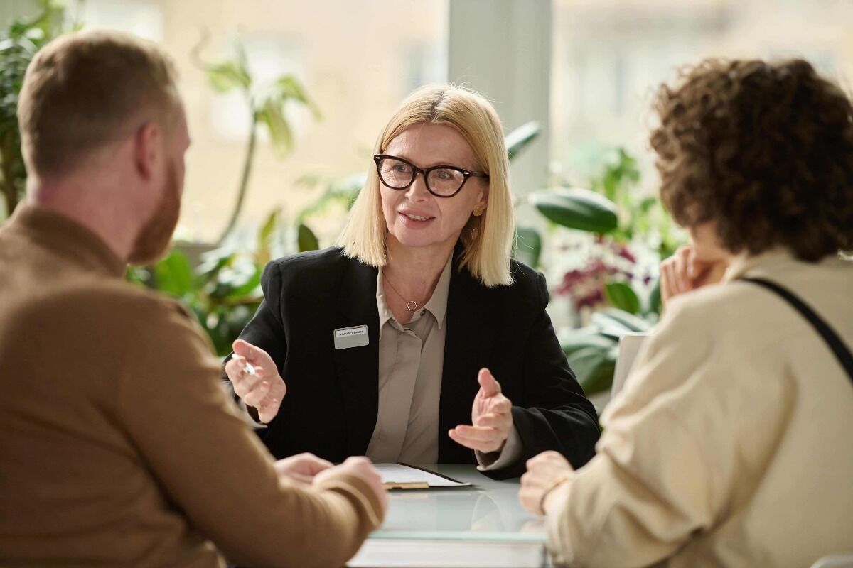 insurance broker explaining surety bonds to business owners